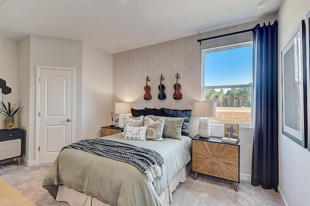 bedroom featuring carpet and baseboards