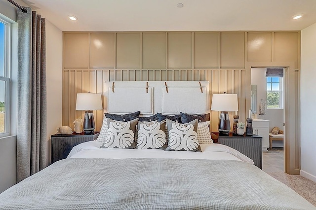 bedroom featuring recessed lighting, baseboards, and light colored carpet