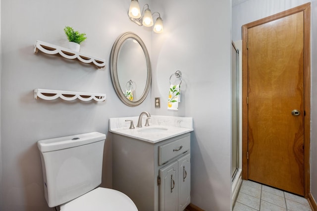 full bath featuring tile patterned flooring, vanity, toilet, and a stall shower