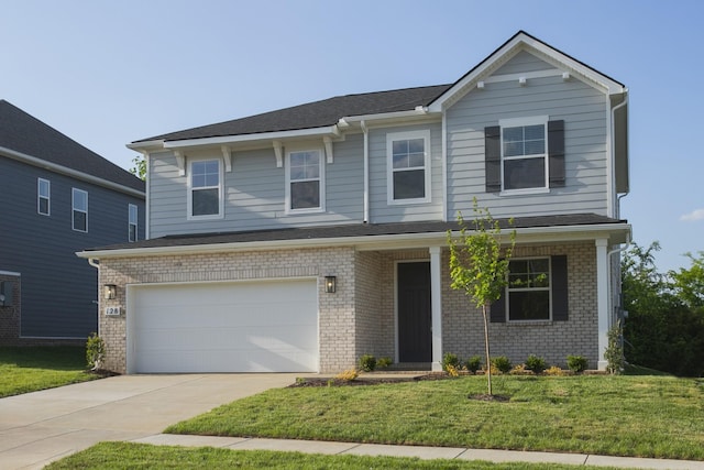 view of front of house with concrete driveway, brick siding, an attached garage, and a front yard