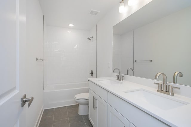 bathroom with toilet, tile patterned floors, visible vents, and a sink