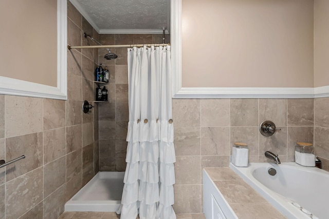 full bath with a tile shower, a textured ceiling, and tile walls