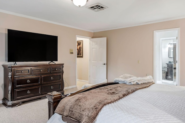 bedroom with visible vents, light carpet, crown molding, baseboards, and ensuite bathroom