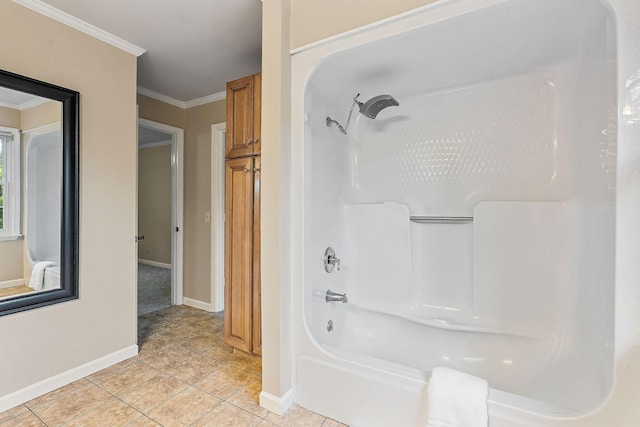 full bathroom with baseboards, crown molding, tile patterned floors, and shower / bath combination