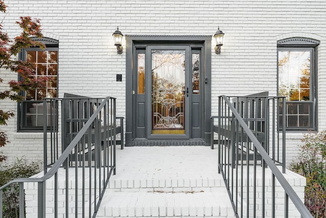 property entrance with brick siding