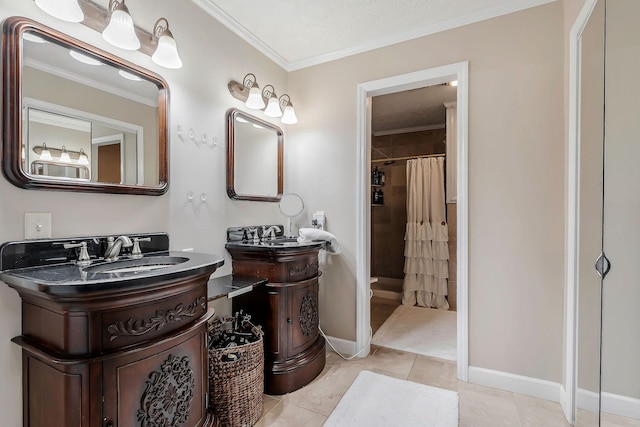 bathroom with tile patterned floors, a shower with shower curtain, baseboards, ornamental molding, and two vanities