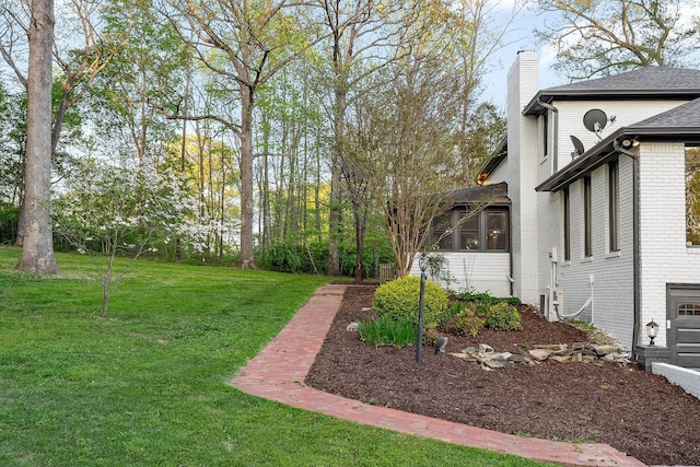 view of yard with a sunroom