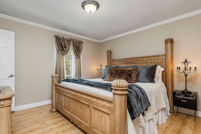 bedroom featuring baseboards, crown molding, and light wood-style floors