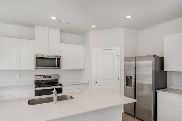 118 Olivia Cir, Chapel Hill, TN 37034 - kitchen with appliances with stainless steel finishes, a sink, white cabinets, light countertops, and recessed lighting