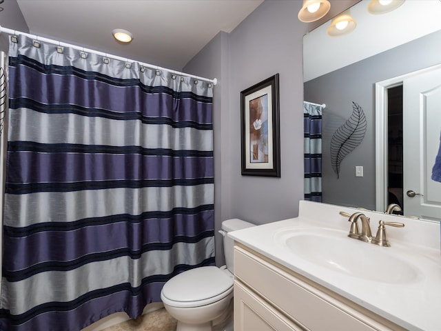 bathroom featuring toilet, a shower with curtain, and vanity