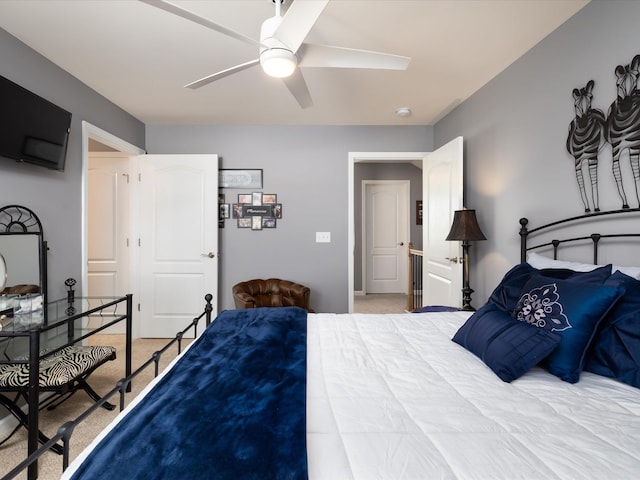 bedroom with light colored carpet and ceiling fan