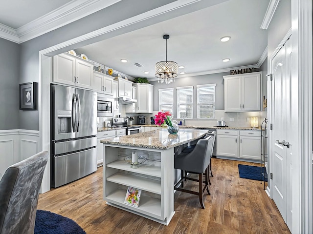 kitchen with white cabinets, crown molding, open shelves, and stainless steel appliances