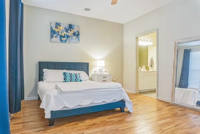 bedroom featuring light wood-style flooring, baseboards, connected bathroom, and a ceiling fan