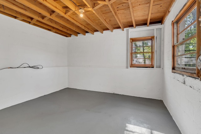unfurnished room featuring finished concrete floors and plenty of natural light
