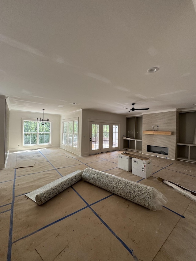 446 Roberts St, Murfreesboro, TN 37130 - unfurnished living room with a large fireplace, a ceiling fan, and plenty of natural light