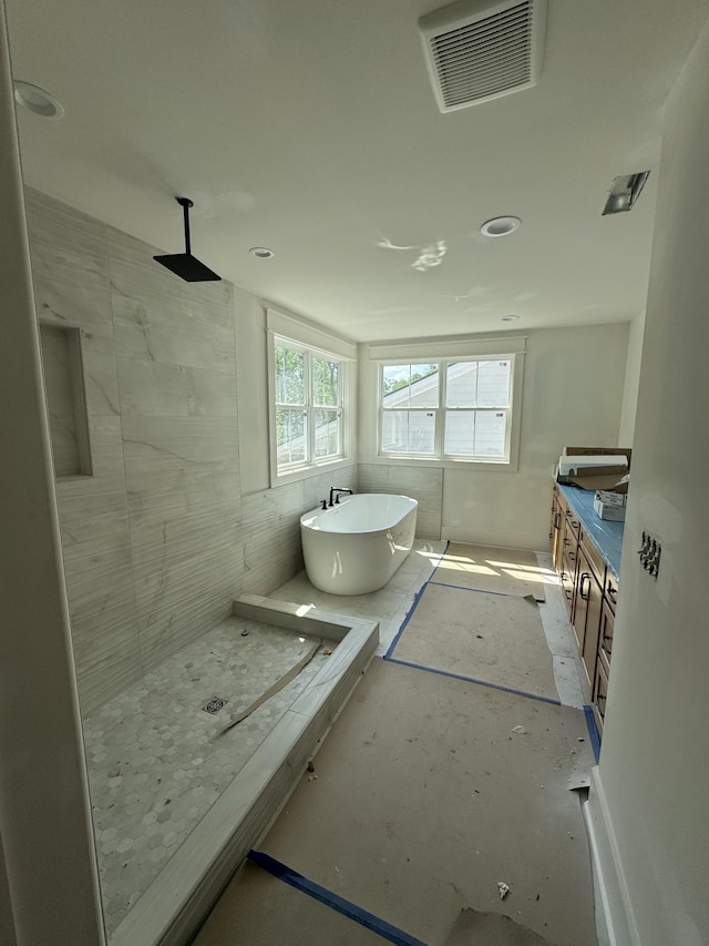 446 Roberts St, Murfreesboro, TN 37130 - bathroom with a tile shower, visible vents, and a freestanding tub