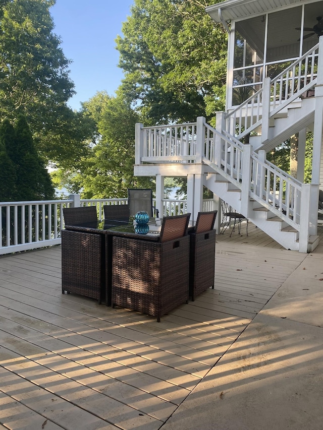 15 Cheekwood Ln, Cadiz, KY 42211 - wooden deck featuring outdoor dining area, a sunroom, and stairs