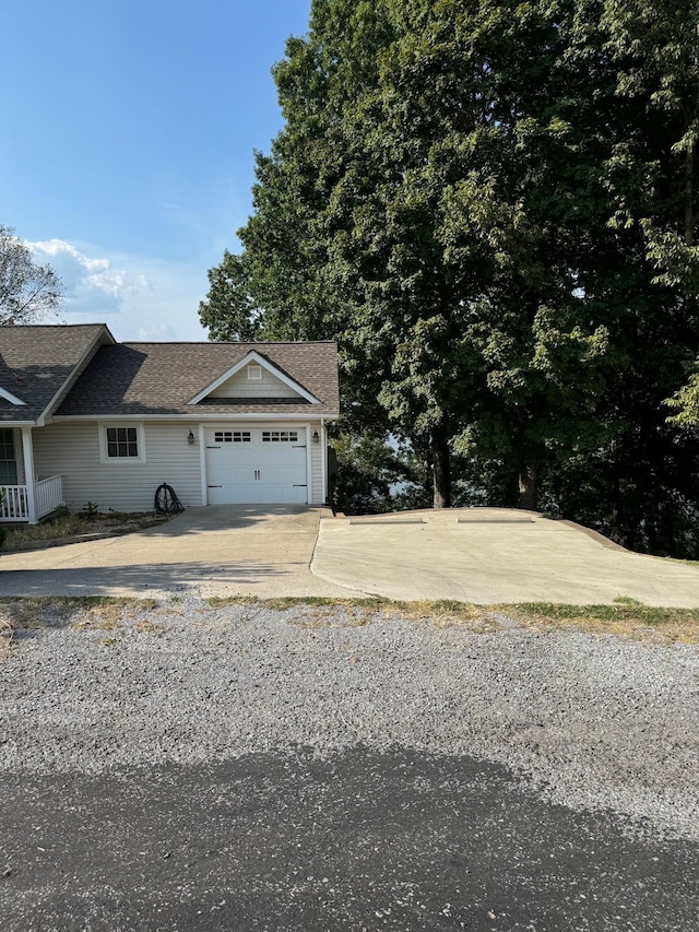 15 Cheekwood Ln, Cadiz, KY 42211 - view of front of property with driveway, a shingled roof, and a garage