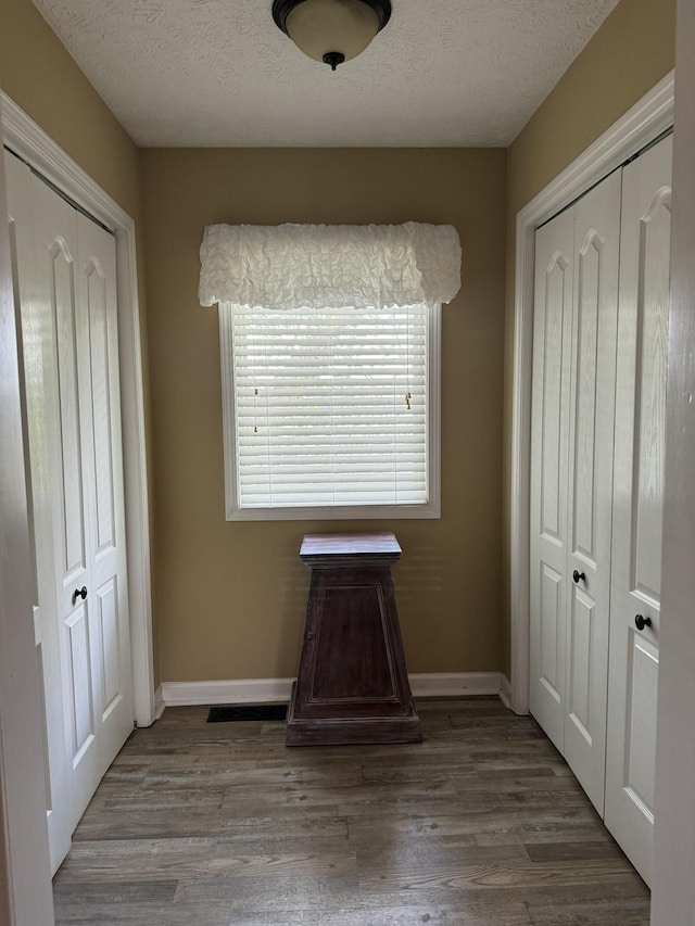 15 Cheekwood Ln, Cadiz, KY 42211 - unfurnished bedroom with wood finished floors, a textured ceiling, and baseboards
