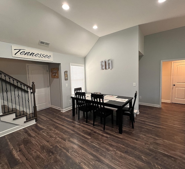 dining area featuring baseboards, visible vents, lofted ceiling, wood finished floors, and stairway
