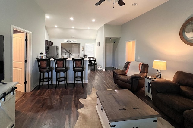 living room featuring recessed lighting, lofted ceiling, a ceiling fan, baseboards, and dark wood-style flooring