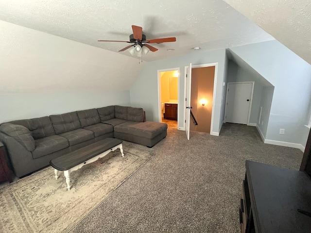 carpeted living room with vaulted ceiling, baseboards, a textured ceiling, and ceiling fan