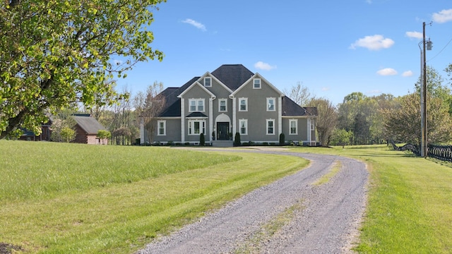 view of front of home featuring driveway and a front yard