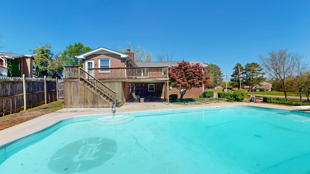 1001 Clearview Dr, Mount Juliet, TN 37122 - view of swimming pool with fence, a wooden deck, a fenced in pool, and stairs