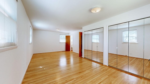 1001 Clearview Dr, Mount Juliet, TN 37122 - unfurnished bedroom featuring two closets, baseboards, and light wood-style flooring