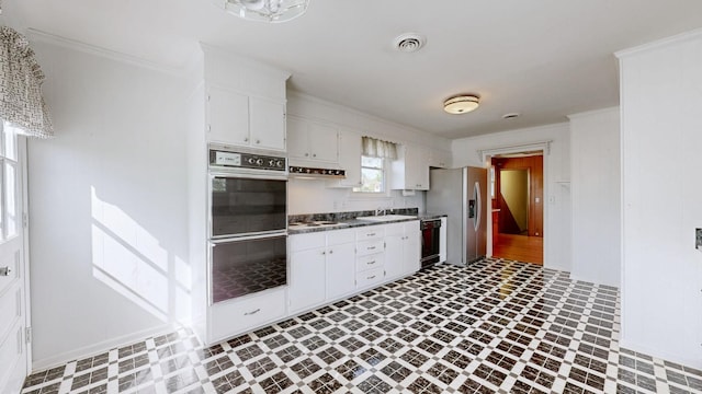 1001 Clearview Dr, Mount Juliet, TN 37122 - kitchen with stainless steel fridge with ice dispenser, visible vents, ornamental molding, white stovetop, and black dishwasher