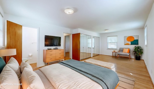 1001 Clearview Dr, Mount Juliet, TN 37122 - bedroom featuring multiple closets, baseboards, and light wood-style floors