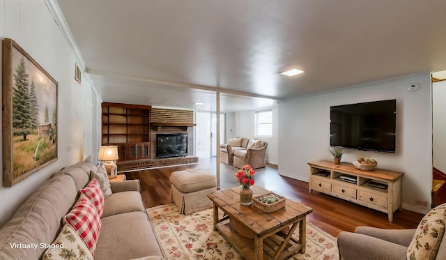 1001 Clearview Dr, Mount Juliet, TN 37122 - living area featuring wood finished floors, visible vents, a fireplace, and crown molding