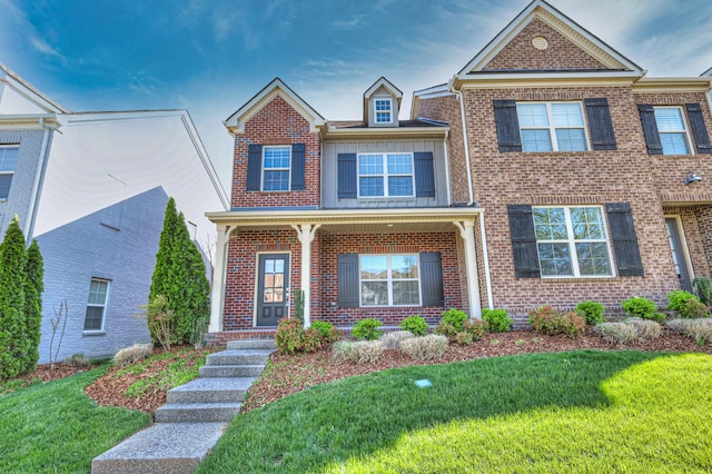 956 Innsbrooke Ave, Hendersonville, TN 37075 - view of front facade featuring brick siding, a front lawn, and covered porch