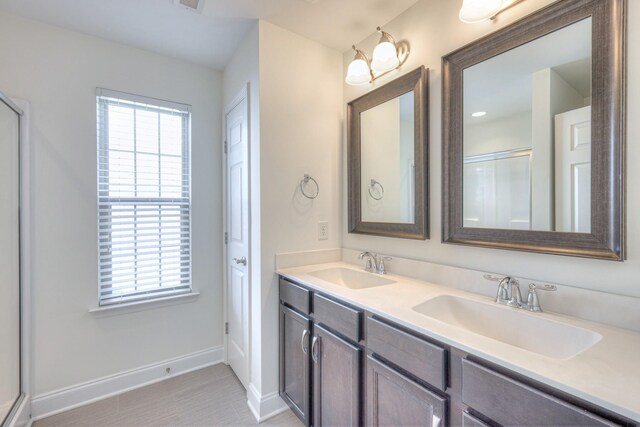 956 Innsbrooke Ave, Hendersonville, TN 37075 - bathroom featuring double vanity, baseboards, and a shower with shower door
