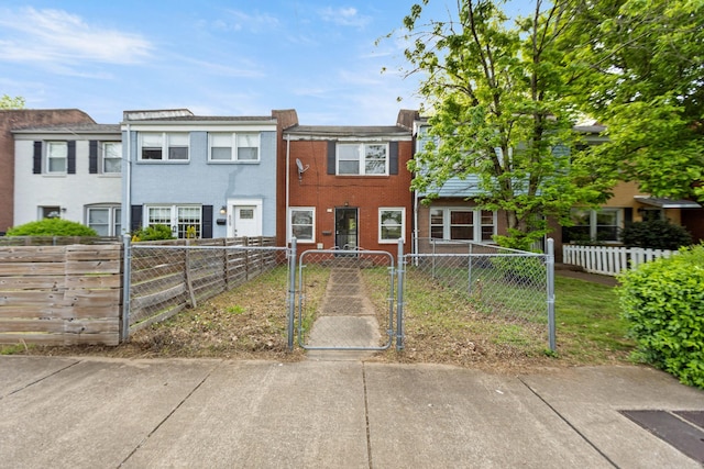 view of property featuring a gate and a fenced front yard