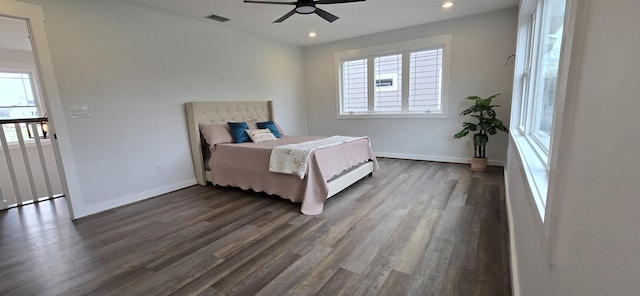 bedroom with visible vents, dark wood-style flooring, recessed lighting, and multiple windows