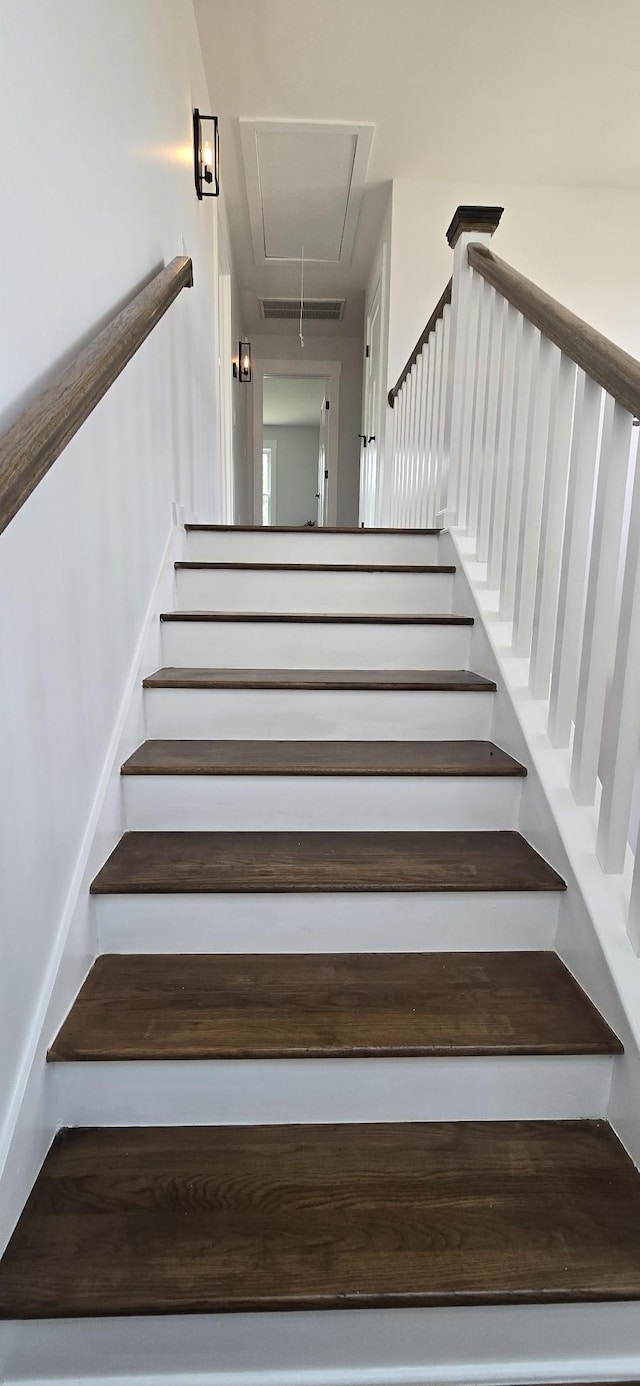 stairway featuring attic access