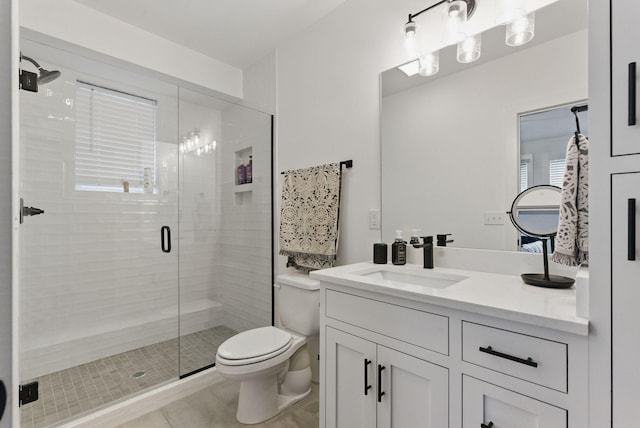 2002 Manchester Ave, Nashville, TN 37218 - full bath with a shower stall, toilet, vanity, and tile patterned flooring