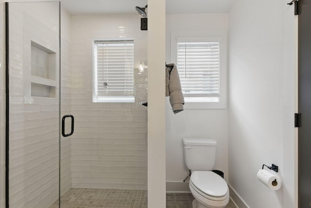 2002 Manchester Ave, Nashville, TN 37218 - bathroom featuring baseboards, toilet, and a stall shower