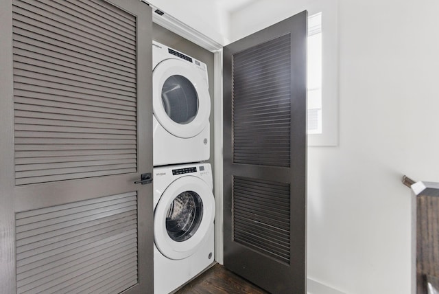 2002 Manchester Ave, Nashville, TN 37218 - laundry room featuring dark wood-style flooring, stacked washer and dryer, and laundry area