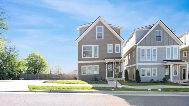 2006 Manchester Ave, Nashville, TN 37218 - view of front facade featuring fence and board and batten siding
