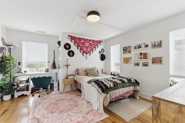 2006 Manchester Ave, Nashville, TN 37218 - bedroom featuring wood finished floors, visible vents, and multiple windows