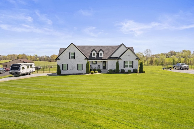 modern farmhouse featuring a front lawn and driveway