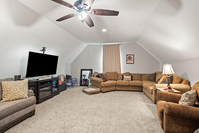 carpeted living area with lofted ceiling and a ceiling fan