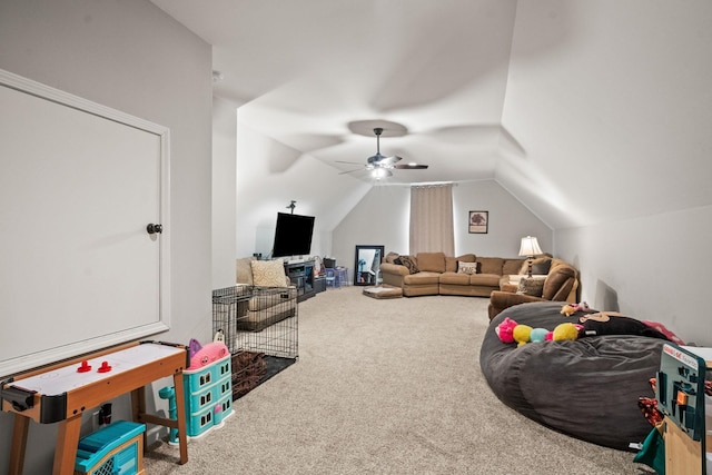 rec room featuring lofted ceiling, a ceiling fan, and carpet flooring