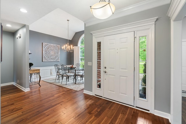 102 Munson Ct, Smyrna, TN 37167 - foyer with dark wood finished floors, a chandelier, plenty of natural light, ornamental molding, and baseboards
