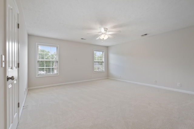 102 Munson Ct, Smyrna, TN 37167 - unfurnished room featuring ceiling fan, light carpet, healthy amount of natural light, baseboards, and a textured ceiling