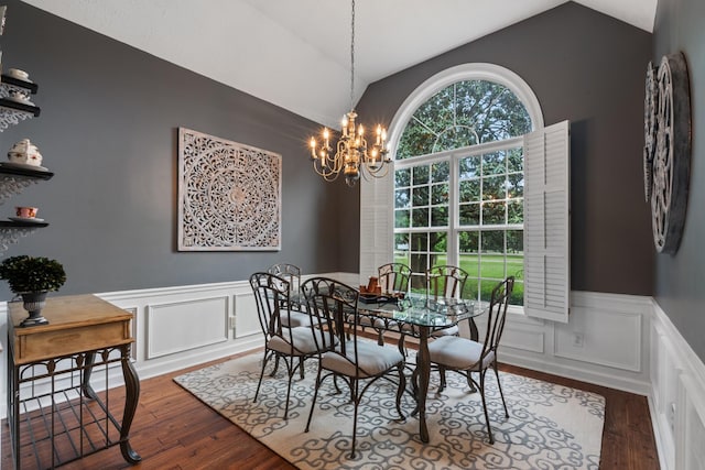 102 Munson Ct, Smyrna, TN 37167 - dining room featuring vaulted ceiling, a chandelier, dark wood-style floors, a wainscoted wall, and a decorative wall