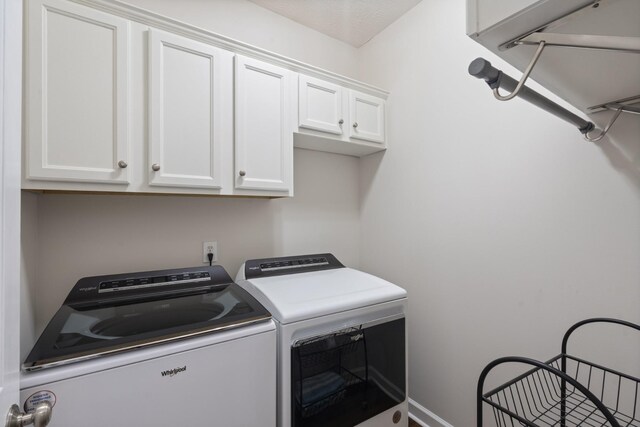 102 Munson Ct, Smyrna, TN 37167 - laundry area featuring washing machine and clothes dryer, cabinet space, and baseboards