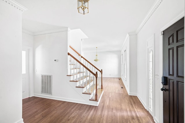 1008 Green Hill Cv, Brentwood, TN 37027 - entrance foyer featuring a chandelier, stairway, visible vents, and wood finished floors